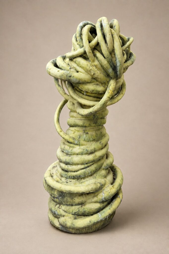 Yellow coiled tower. Ceramic sculpture by Ted Fullwood